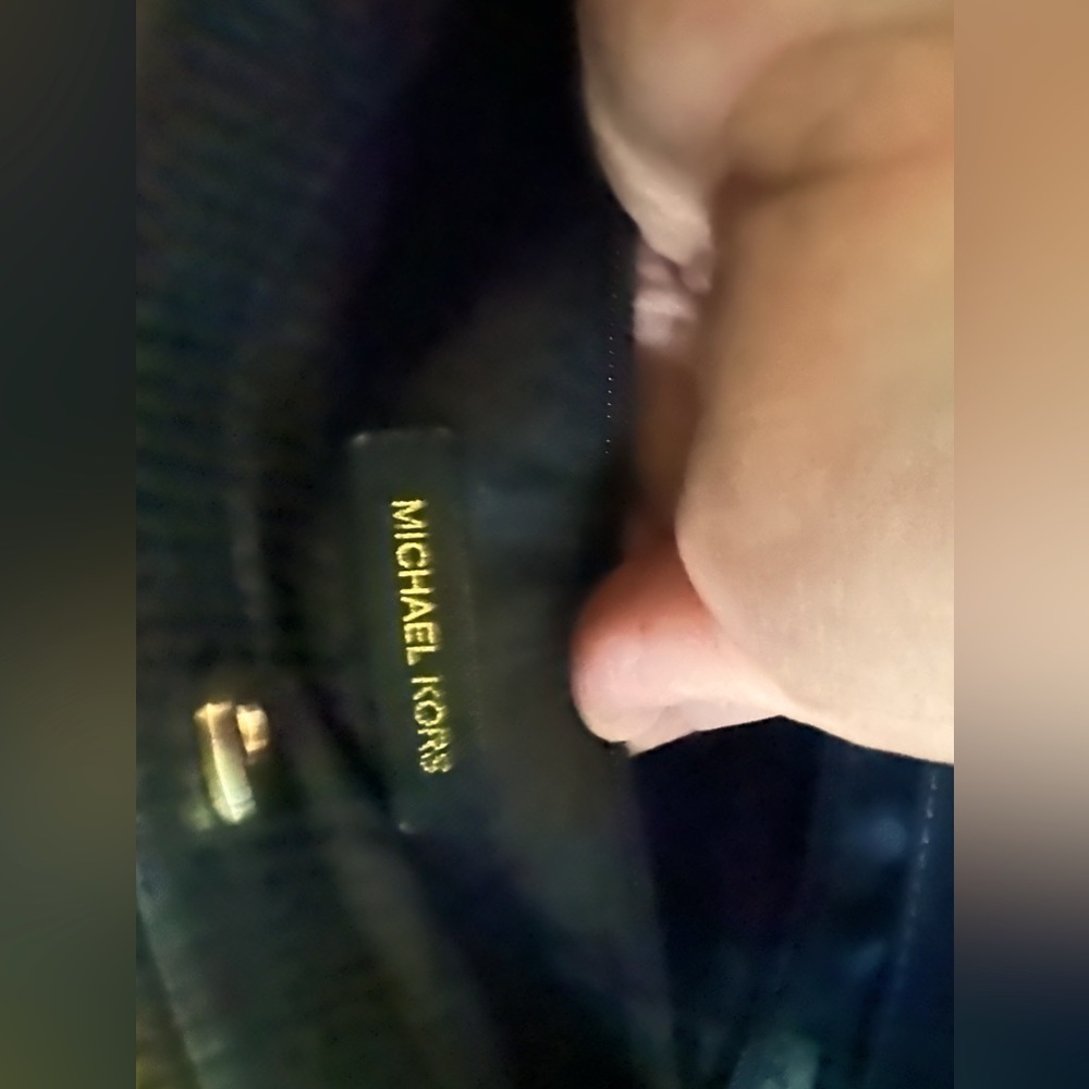 Black Michael Kors hand bag.